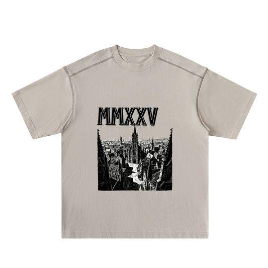 Beige t-shirt with black graphic and 'MMXXV' text on a white background