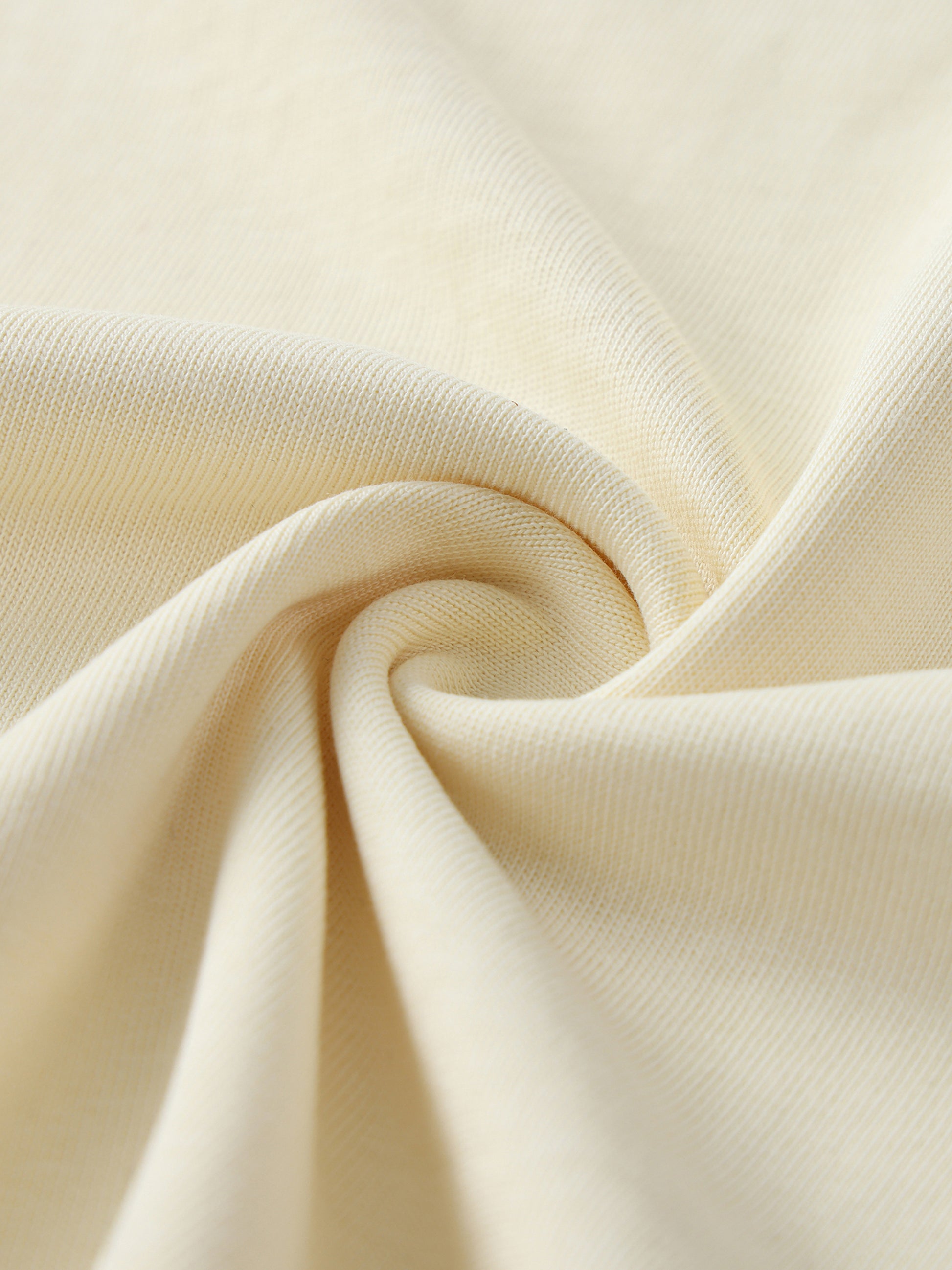 Close-up of beige fabric with folds