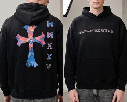 Person wearing a black hoodie with a colorful design on the back and text on the front, standing in a neutral setting.